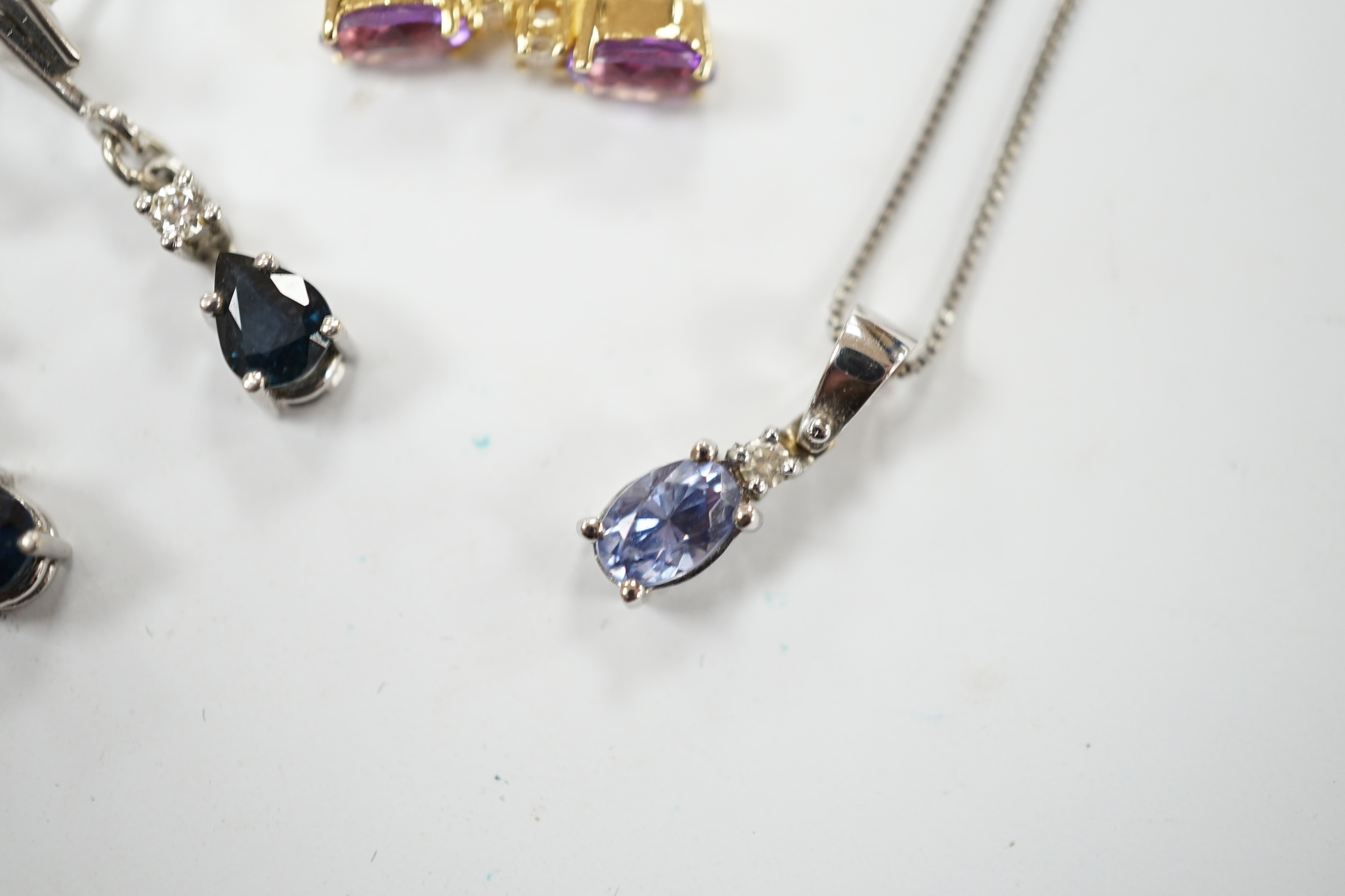A modern 18ct white gold sapphire and diamond set drop pendant, 13mm, on a 925 chain, together with a modern pair of 750 yellow metal, amethyst and diamond set ear studs and a pair of 9ct sapphire and diamond set ear stu